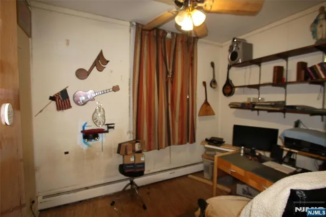 a view of a livingroom with furniture and a window