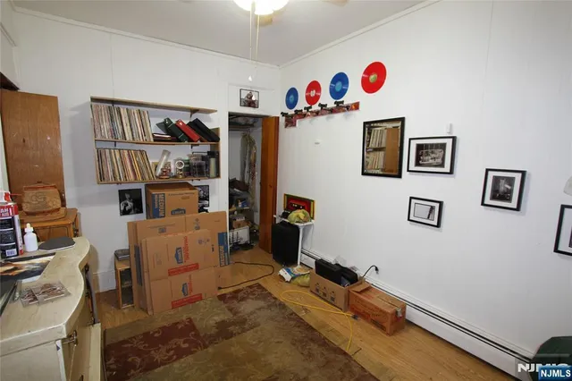 a room with gym equipment and a flat screen tv