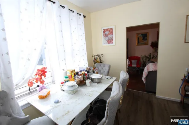 a view of a dining room with furniture and toys