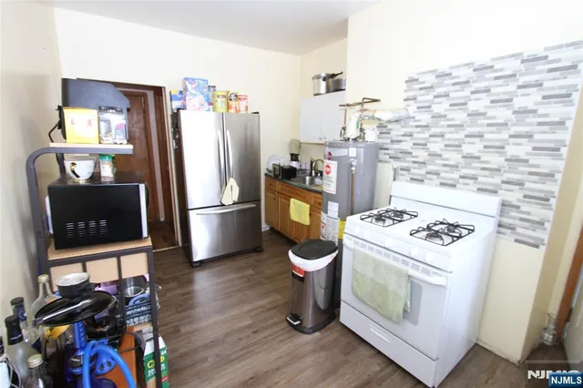 a kitchen with a stove and a refrigerator