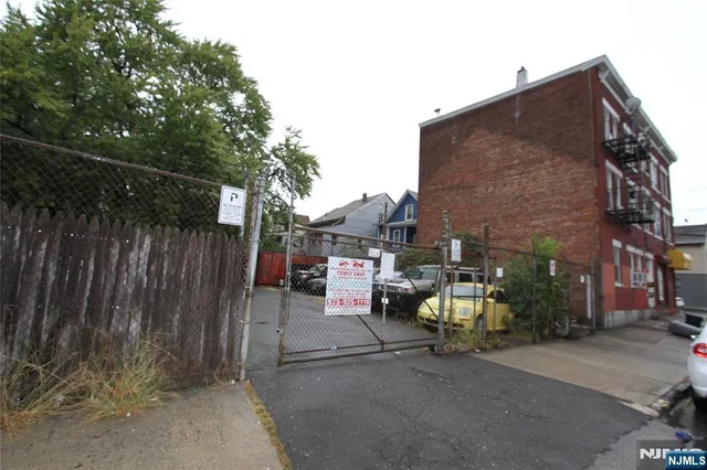 a view of a patio with table and chairs and potted plants