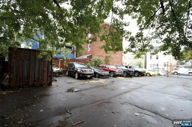 a view of street with parked cars