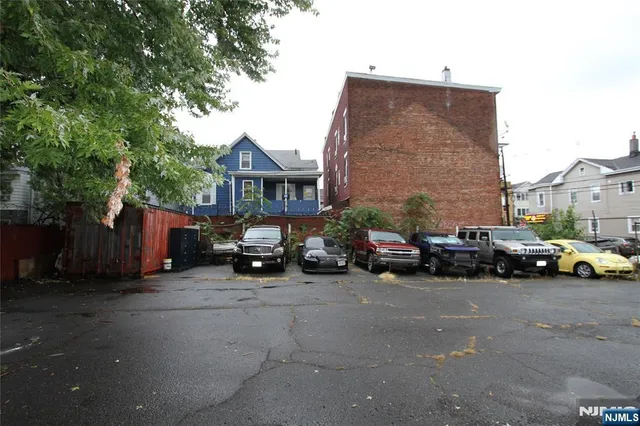 a view of a cars parked in front of a house