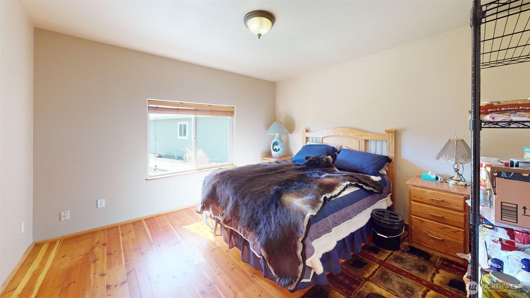 1811 Pine Creek Road Tonasket, WA 98855 - Photo 12 of 38 a bedroom with a bed and a window