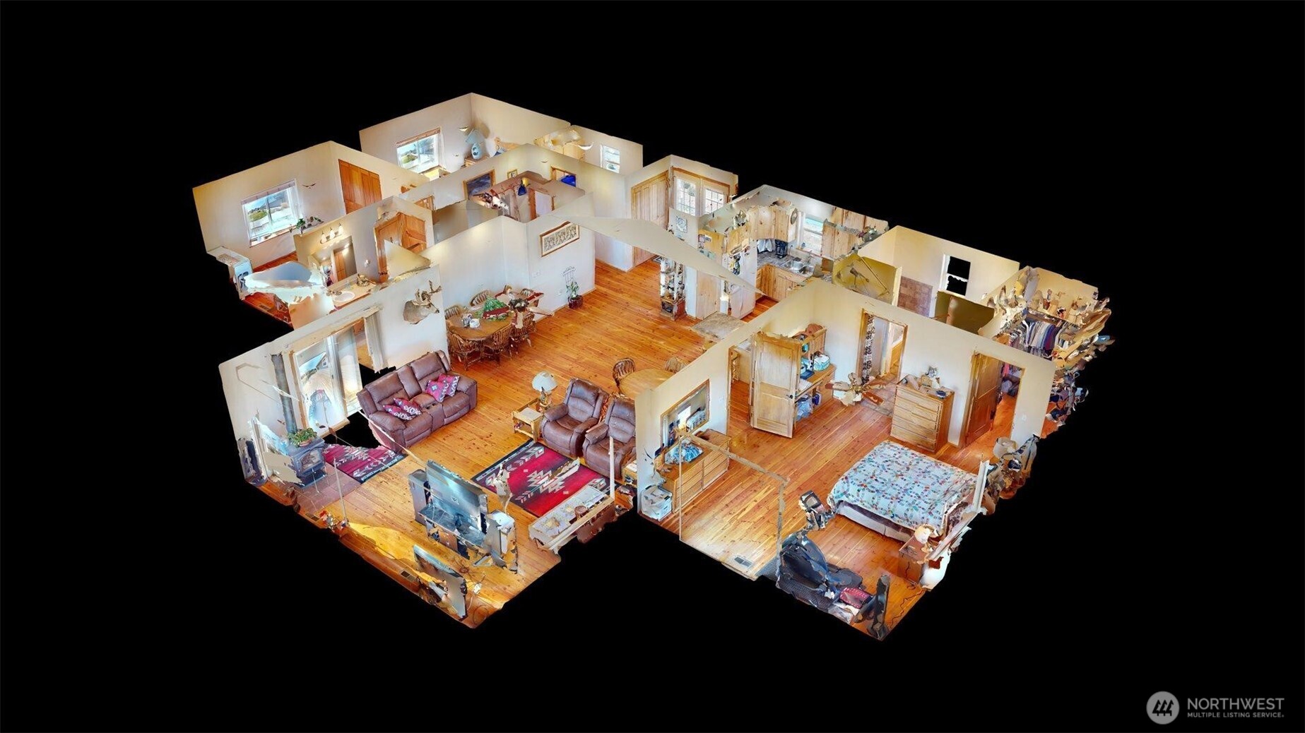 1811 Pine Creek Road Tonasket, WA 98855 - Photo 17 of 38 a bed sitting in a bedroom next to a lamp