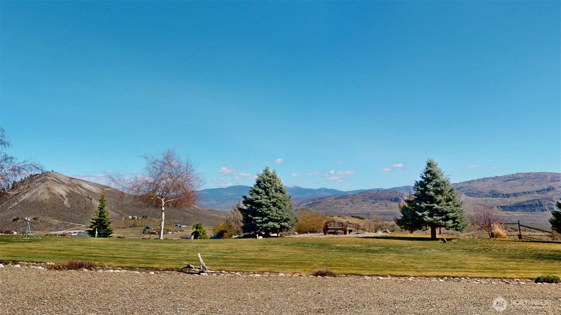 1811 Pine Creek Road Tonasket, WA 98855 - Photo 24 of 38 a view of a lake with a houses