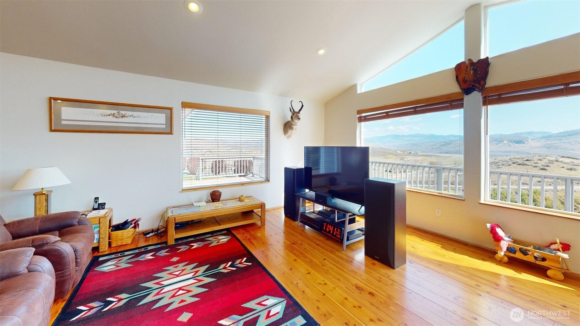 1811 Pine Creek Road Tonasket, WA 98855 - Photo 6 of 38 a bedroom with furniture and a large window