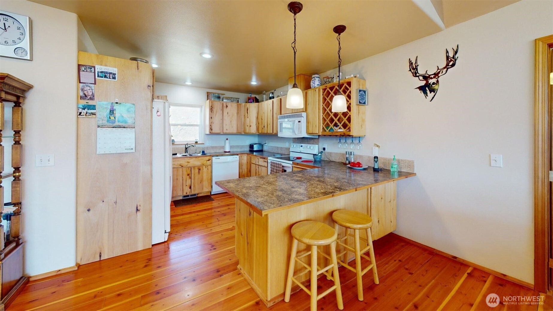 1811 Pine Creek Road Tonasket, WA 98855 - Photo 8 of 38 a kitchen with stainless steel appliances granite countertop a sink and a refrigerator