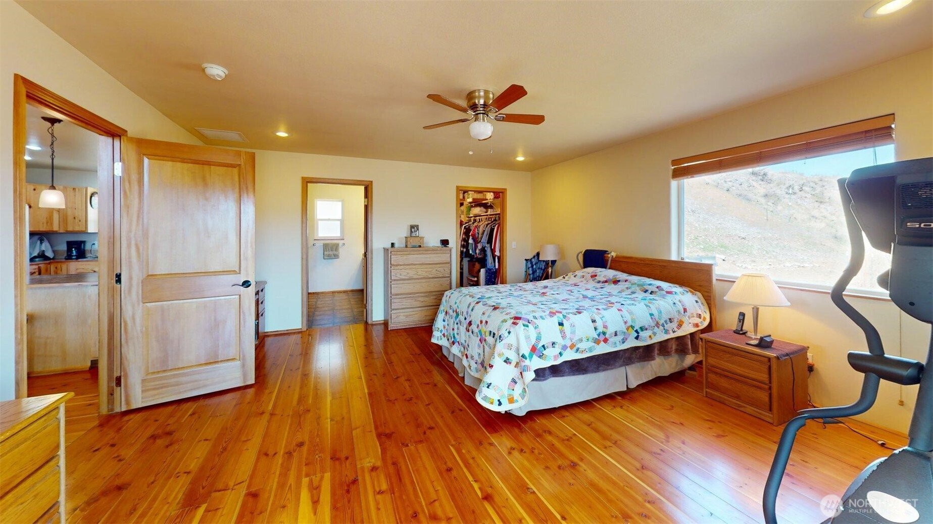 1811 Pine Creek Road Tonasket, WA 98855 - Photo 9 of 38 a bedroom with a bed and wooden floor