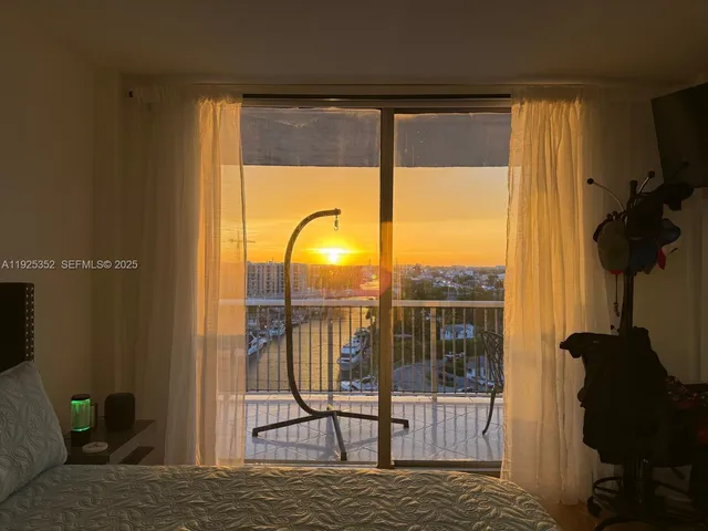 a living room with a large window and a table