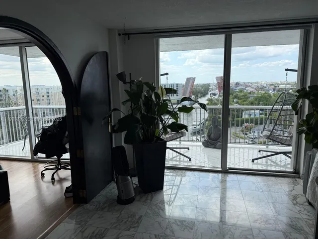 a hallway with a view of living room with furniture