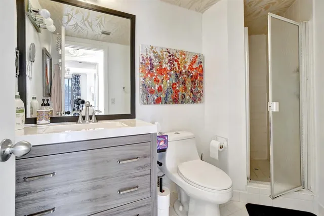 a bedroom with furniture and a large window