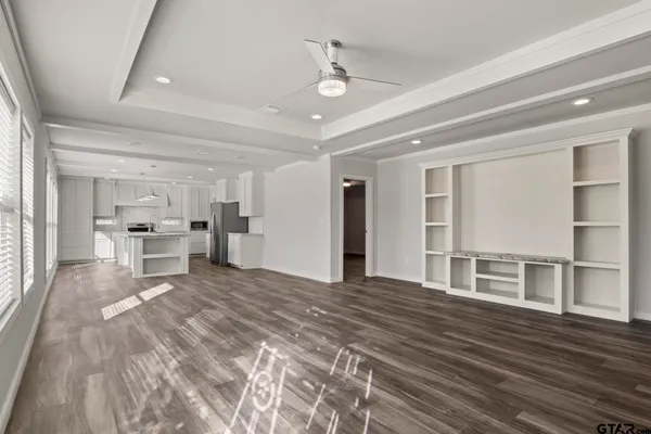 a kitchen with stainless steel appliances white cabinets and a stove a oven with white countertops