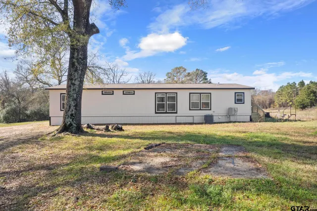 a house view with a backyard space