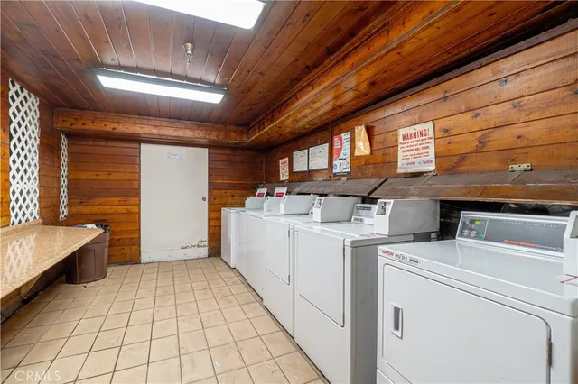 a view of an empty room with car parked