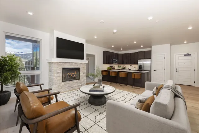 a living room with furniture fireplace and a flat screen tv