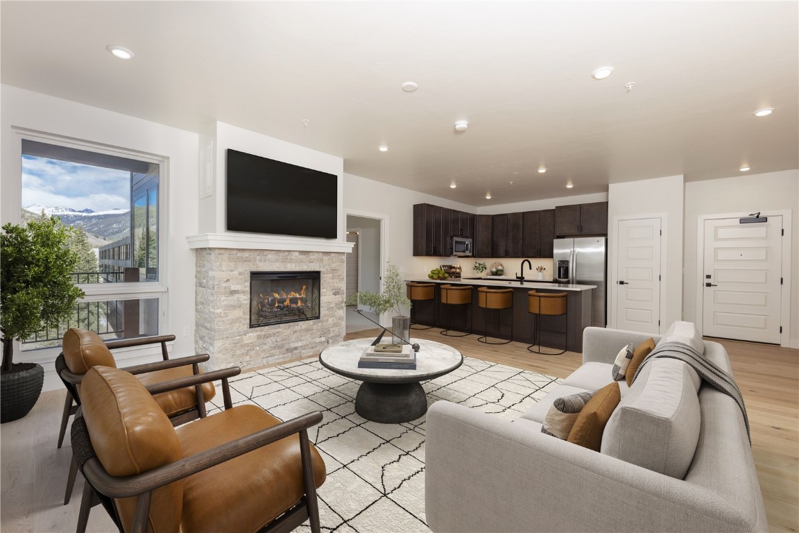 a living room with furniture fireplace and a flat screen tv