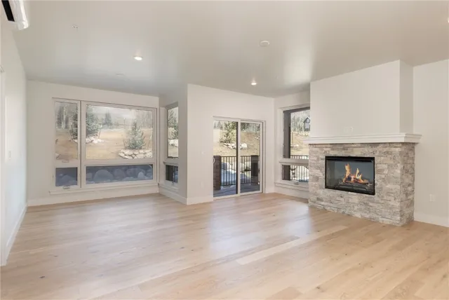 a kitchen with stainless steel appliances a sink and a refrigerator