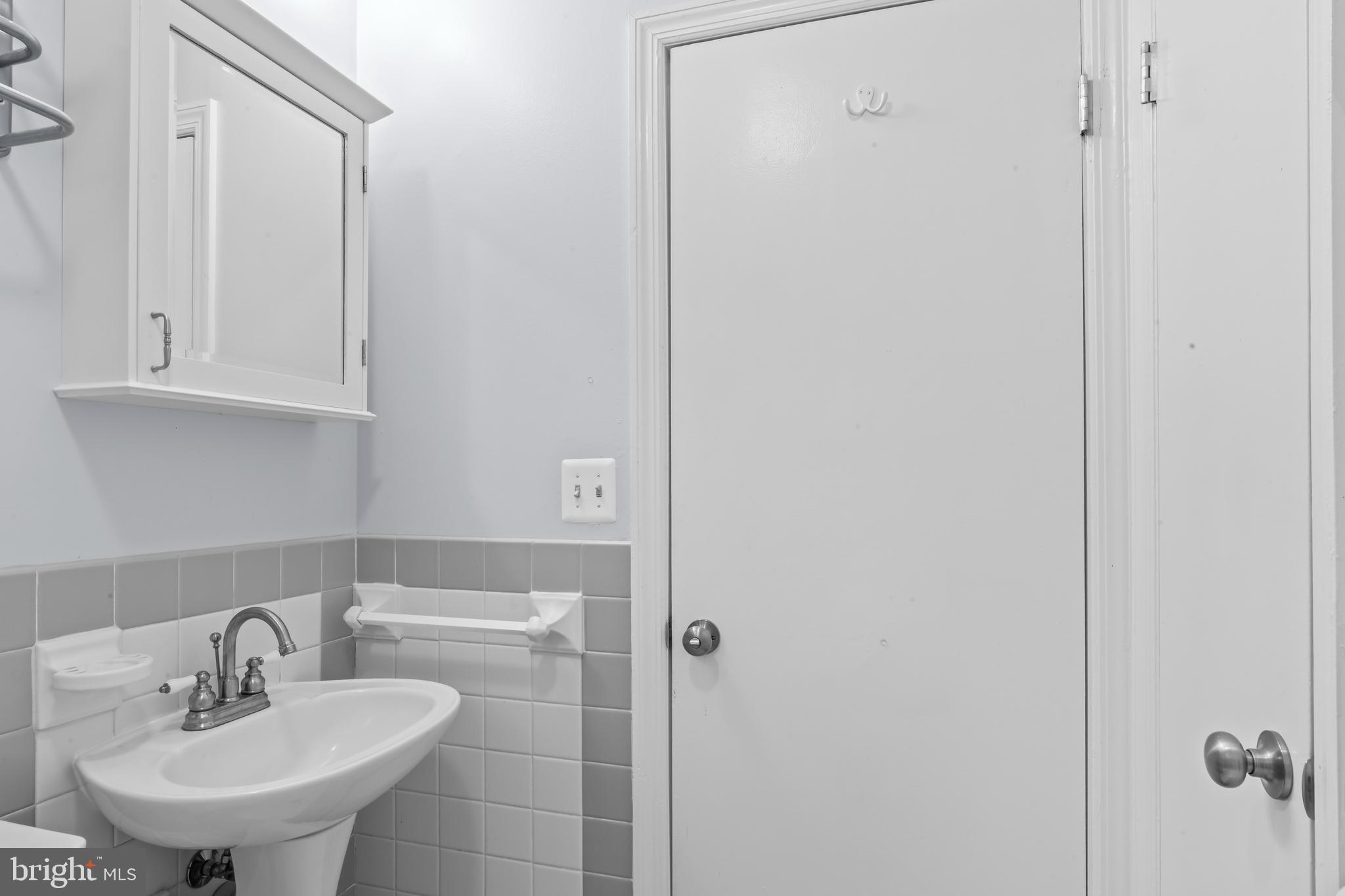 12131 Waples Mill Road Oakton, VA 22124 - Photo 12 of 40 a bathroom with a sink and a mirror
