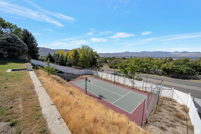 11922 Bluff View Drive Sandy, UT 84092 - Photo 26 of 30 View of tennis court featuring a mountain view