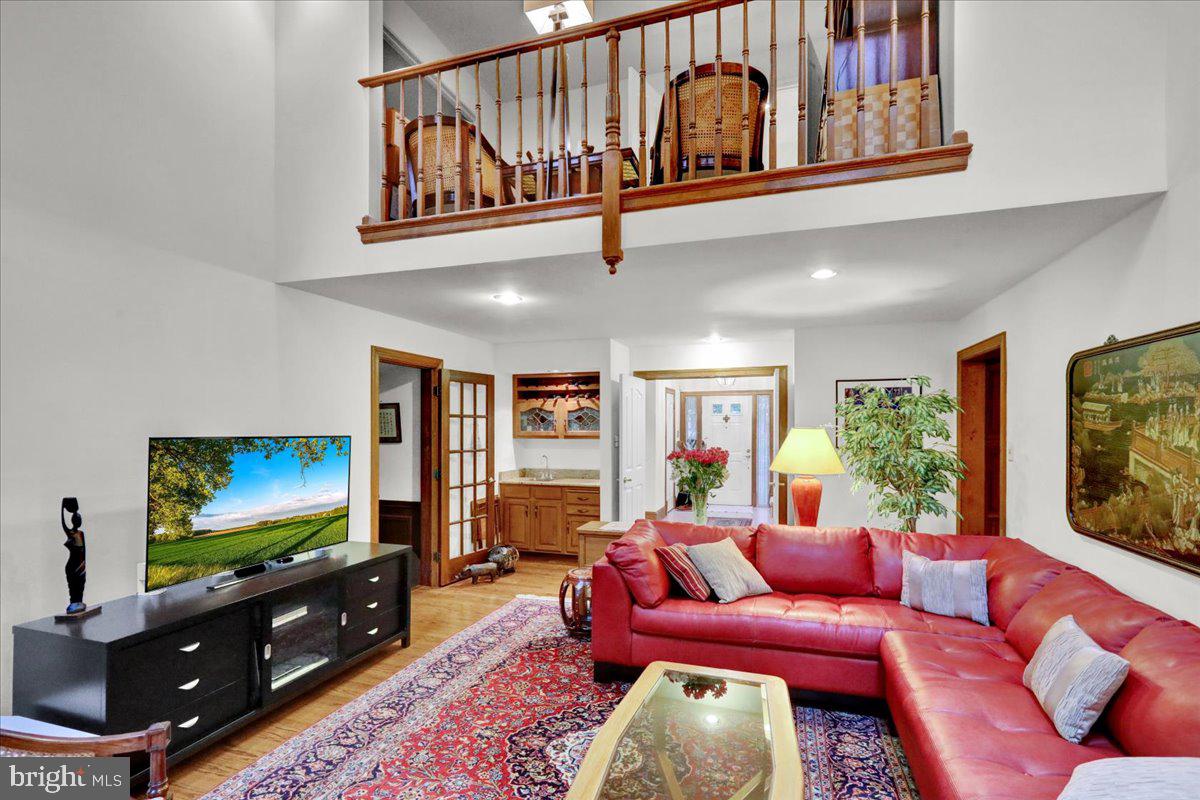 586 Berwyn Baptist Road Devon, PA 19333 - Photo 17 of 49 a living room with furniture and a flat screen tv