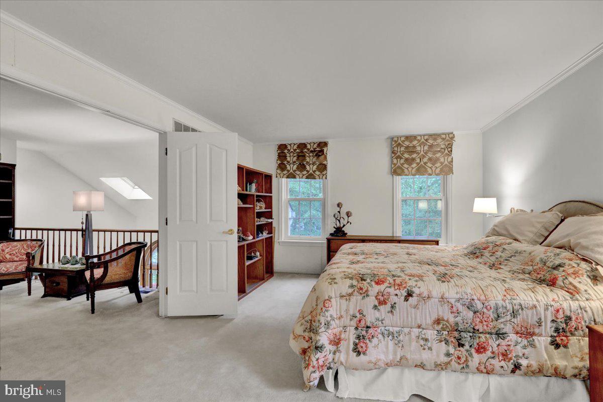 586 Berwyn Baptist Road Devon, PA 19333 - Photo 34 of 49 a bedroom with a bed and a lamp
