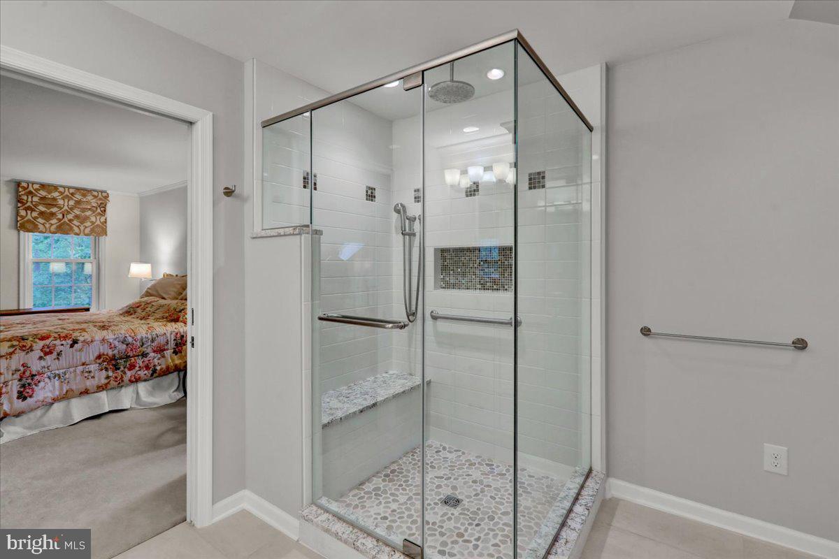 586 Berwyn Baptist Road Devon, PA 19333 - Photo 39 of 49 a bathroom with a glass shower door and a sink