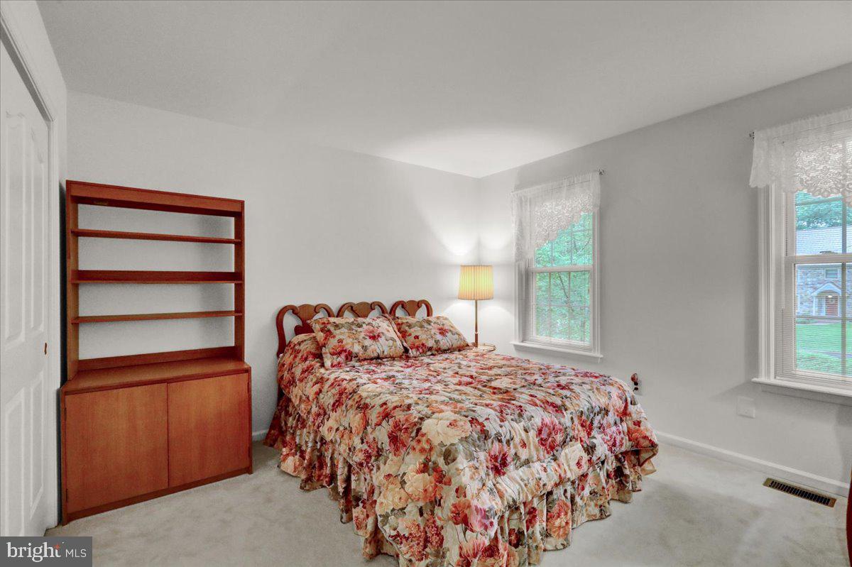 586 Berwyn Baptist Road Devon, PA 19333 - Photo 42 of 49 a bedroom with a bed and a window