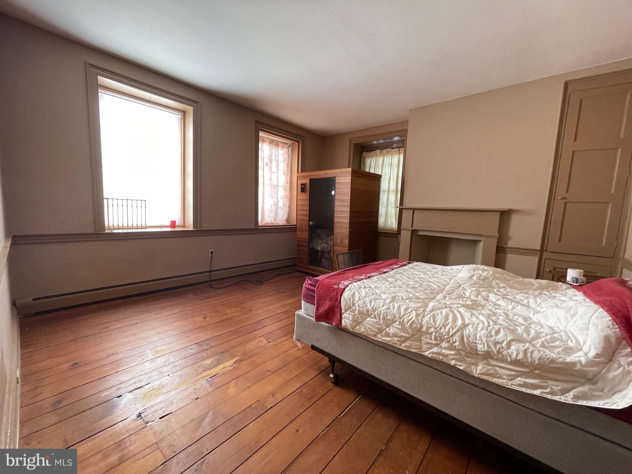 16 Philadelphia Avenue Reading, PA 19607 - Photo 31 of 32 a bed sitting in a bedroom next to a window