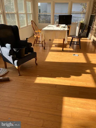 a living room with a table and a flat screen tv