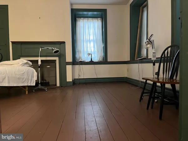 an entryway with wooden floor