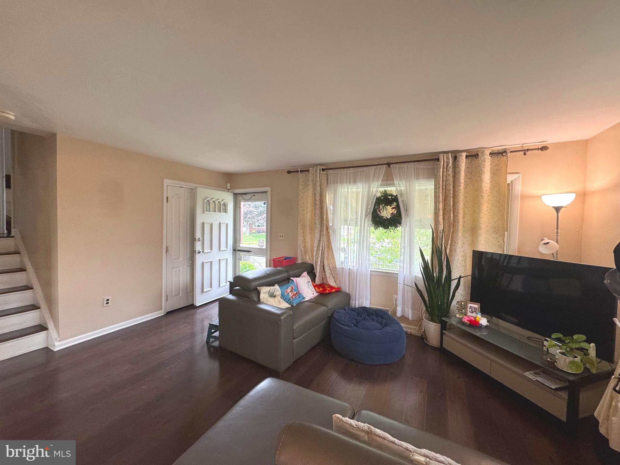 100 Winding Way Hamilton, NJ 08620 - Photo 2 of 9 a living room with furniture and a flat screen tv