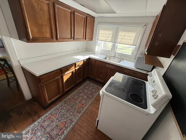 a kitchen with a stove and a microwave