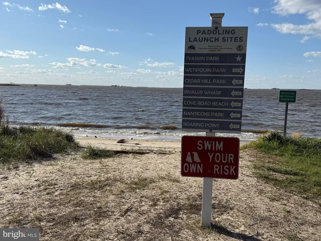 a view of a swimming pool with an outdoor seating