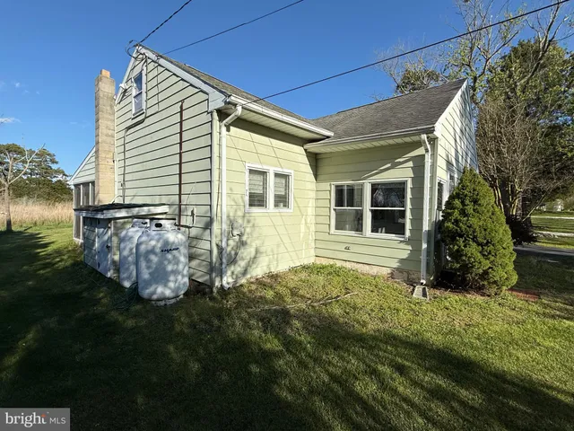 a backyard of a house with lots of green space