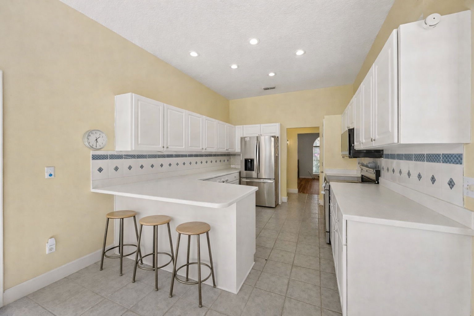 95406 Captains Way Fernandina Beach, FL 32034 - Photo 11 of 51 The layout flows easily into the kitchen, with generous cabinetry, Corian countertops, new LG stainless appliances, and an open connection to the living areas for easy everyday flow.
