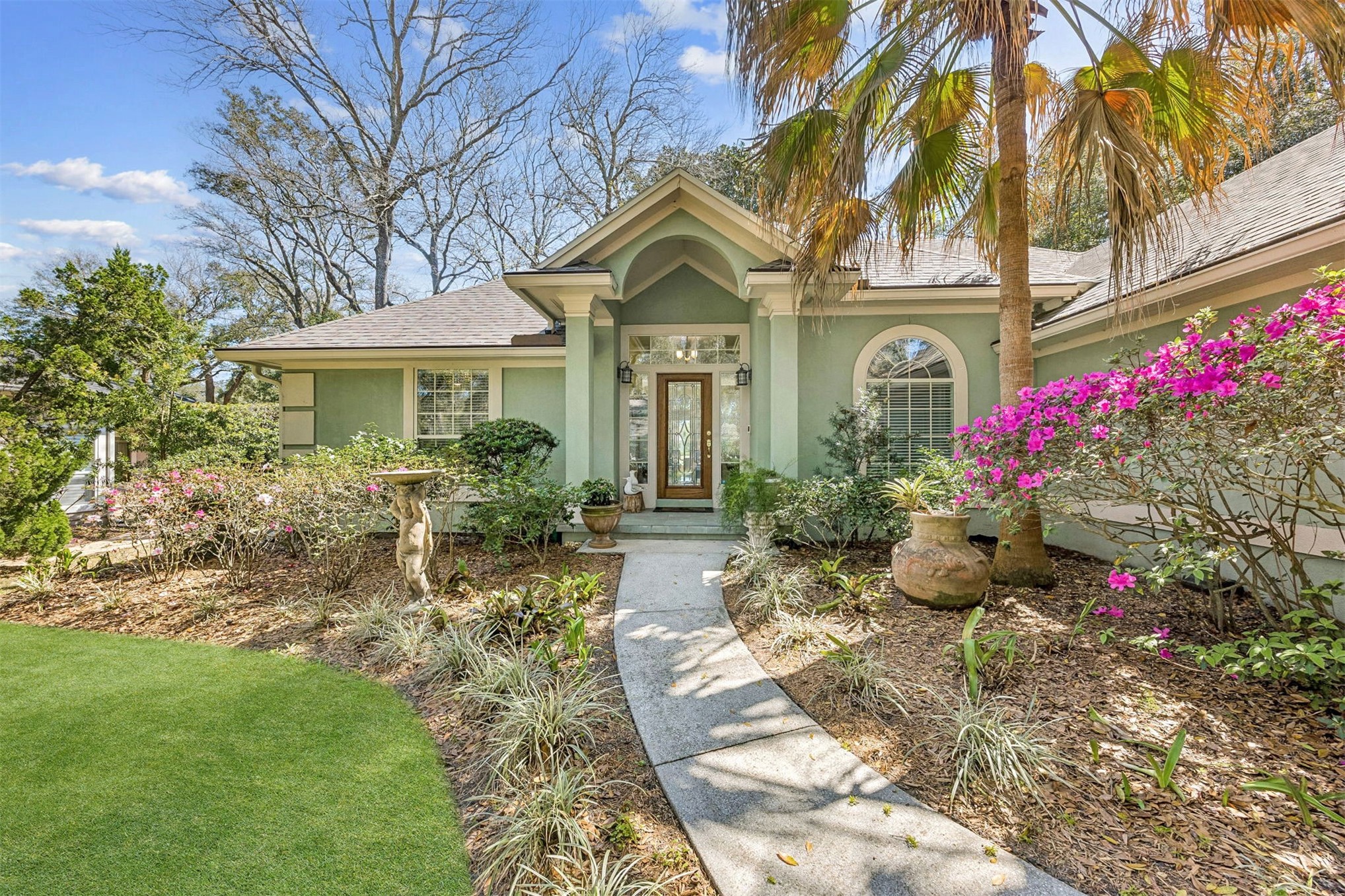 95406 Captains Way Fernandina Beach, FL 32034 - Photo 8 of 51 Lush landscaping and flowering color soften the architecture, while Ring security features add convenience and peace of mind.
