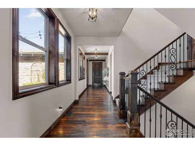 a view of gallery with wooden floor