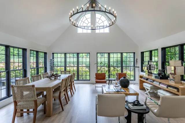 a view of a dining room with furniture window and outside view