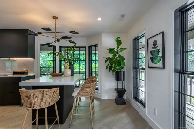 a large kitchen with kitchen island granite countertop a sink and counter space