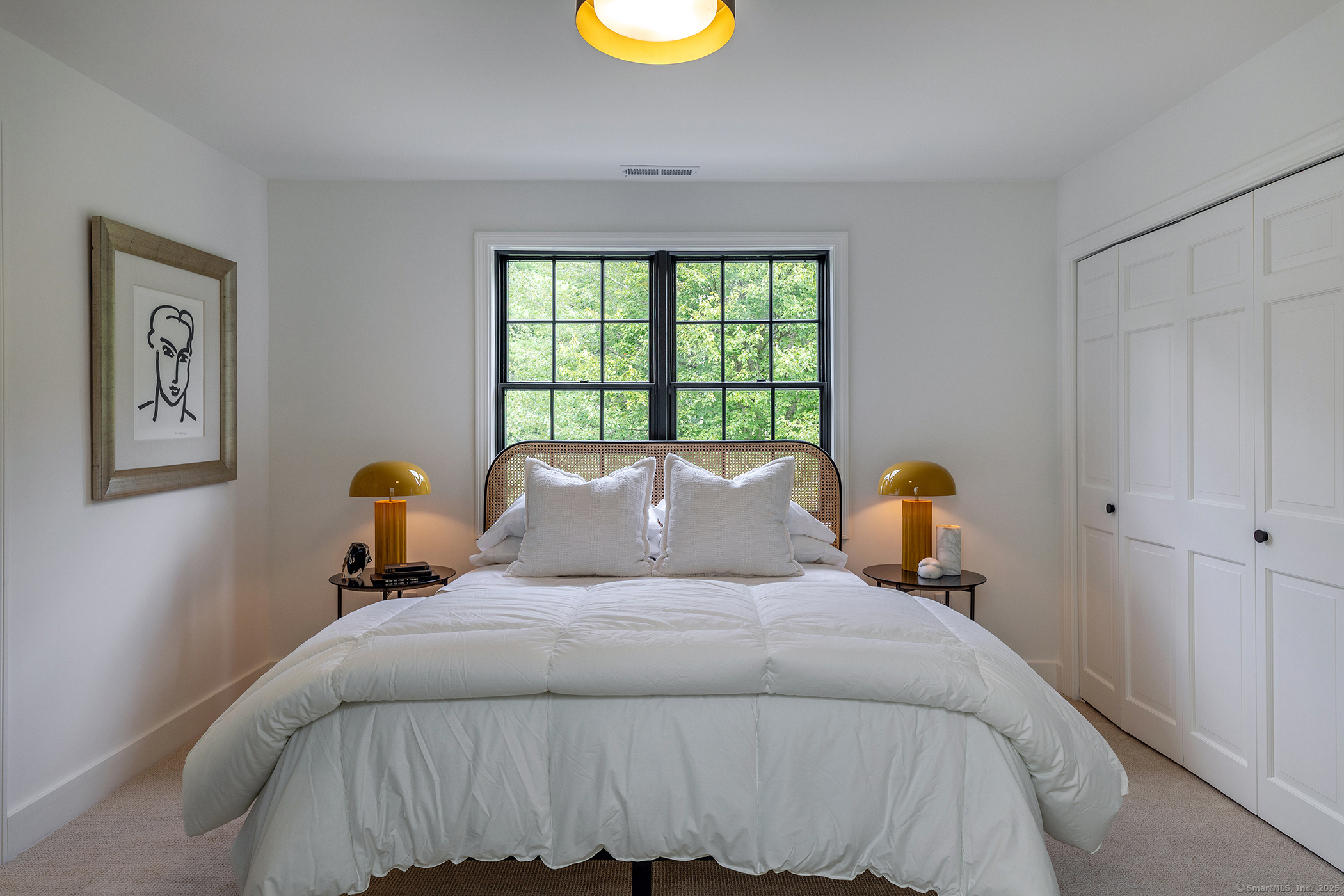 15 Herrick Road Sharon, CT 06069 - Photo 23 of 39 a bed sitting in a bedroom next to a window