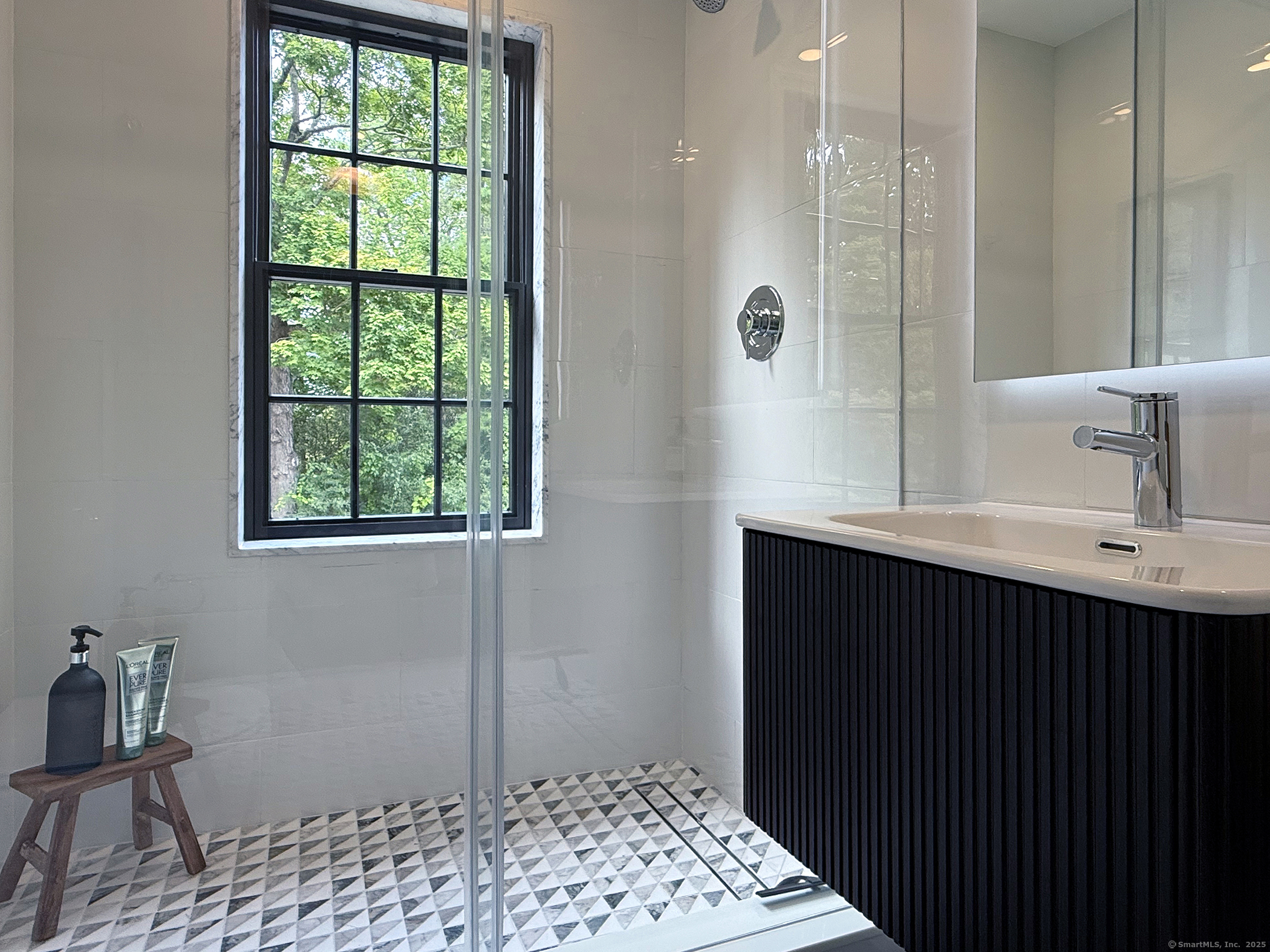 15 Herrick Road Sharon, CT 06069 - Photo 24 of 39 a bathroom with a sink and a mirror