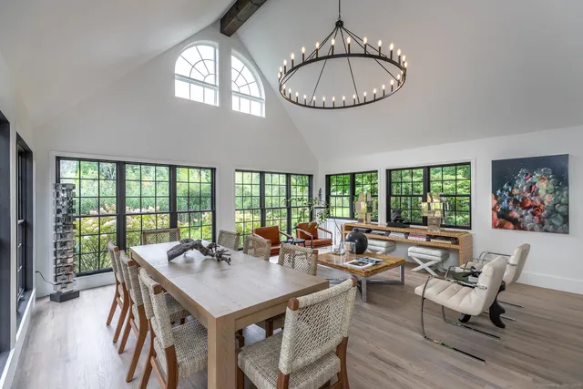 a dining room with furniture and window