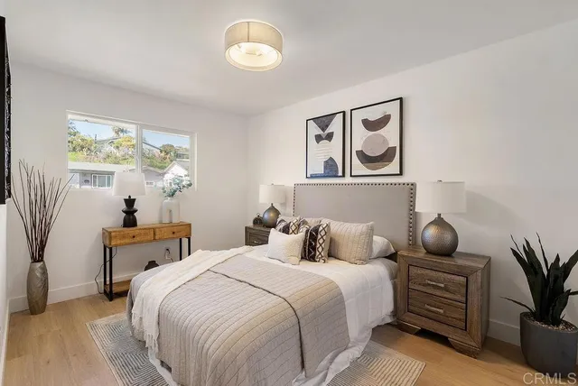 a bedroom with a bed and window