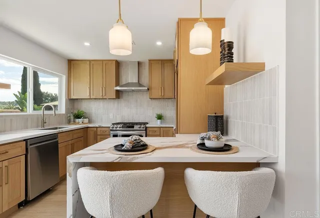 a kitchen with sink a stove and cabinets