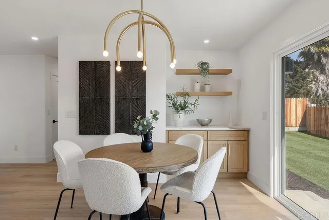 a dining room with furniture and window
