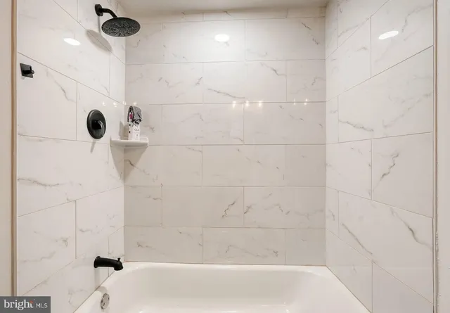 a bathroom with a shower and a bathtub