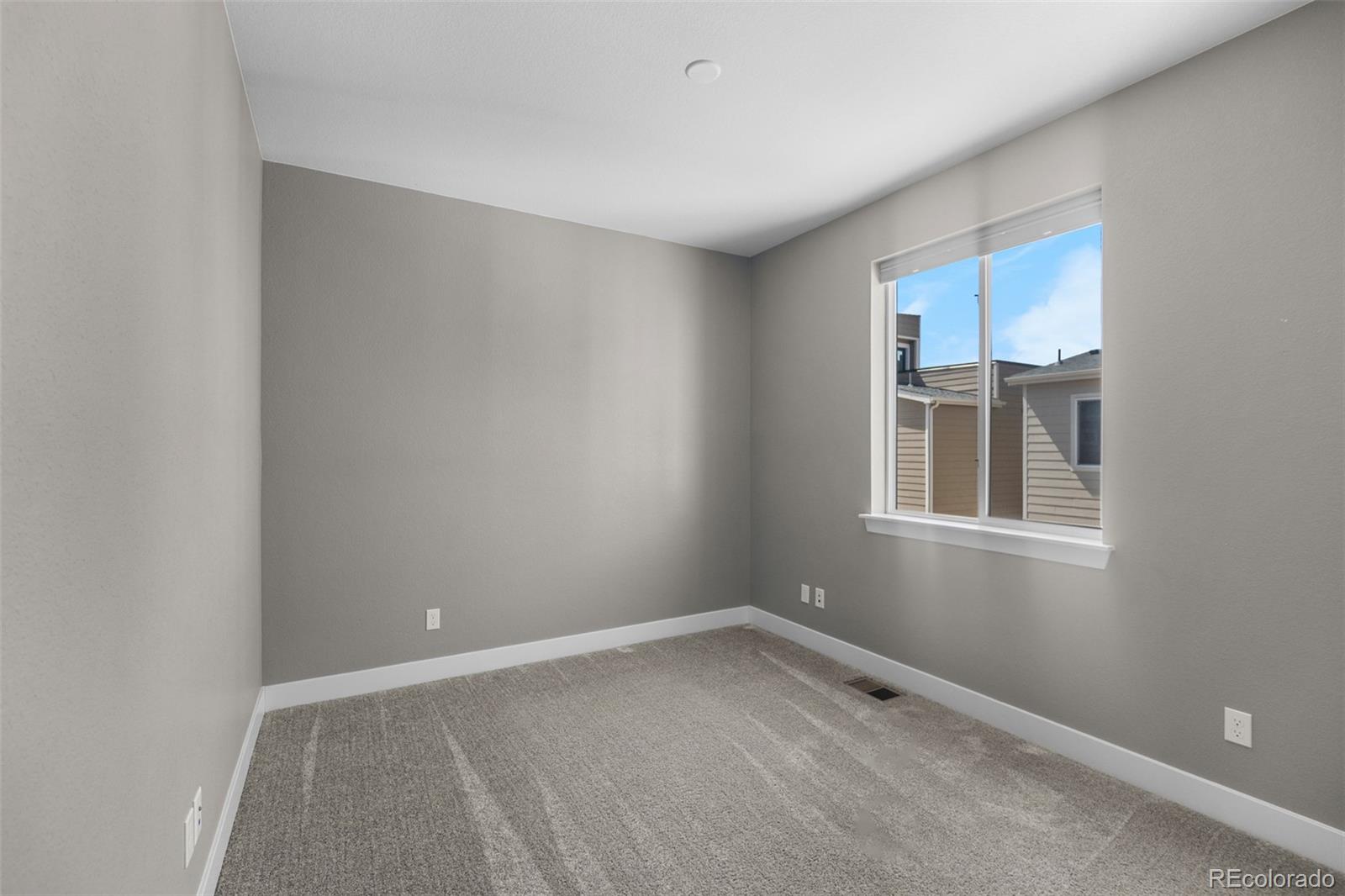 11918 Mountview Lane Broomfield, CO 80021 - Photo 14 of 32 an empty room with a window