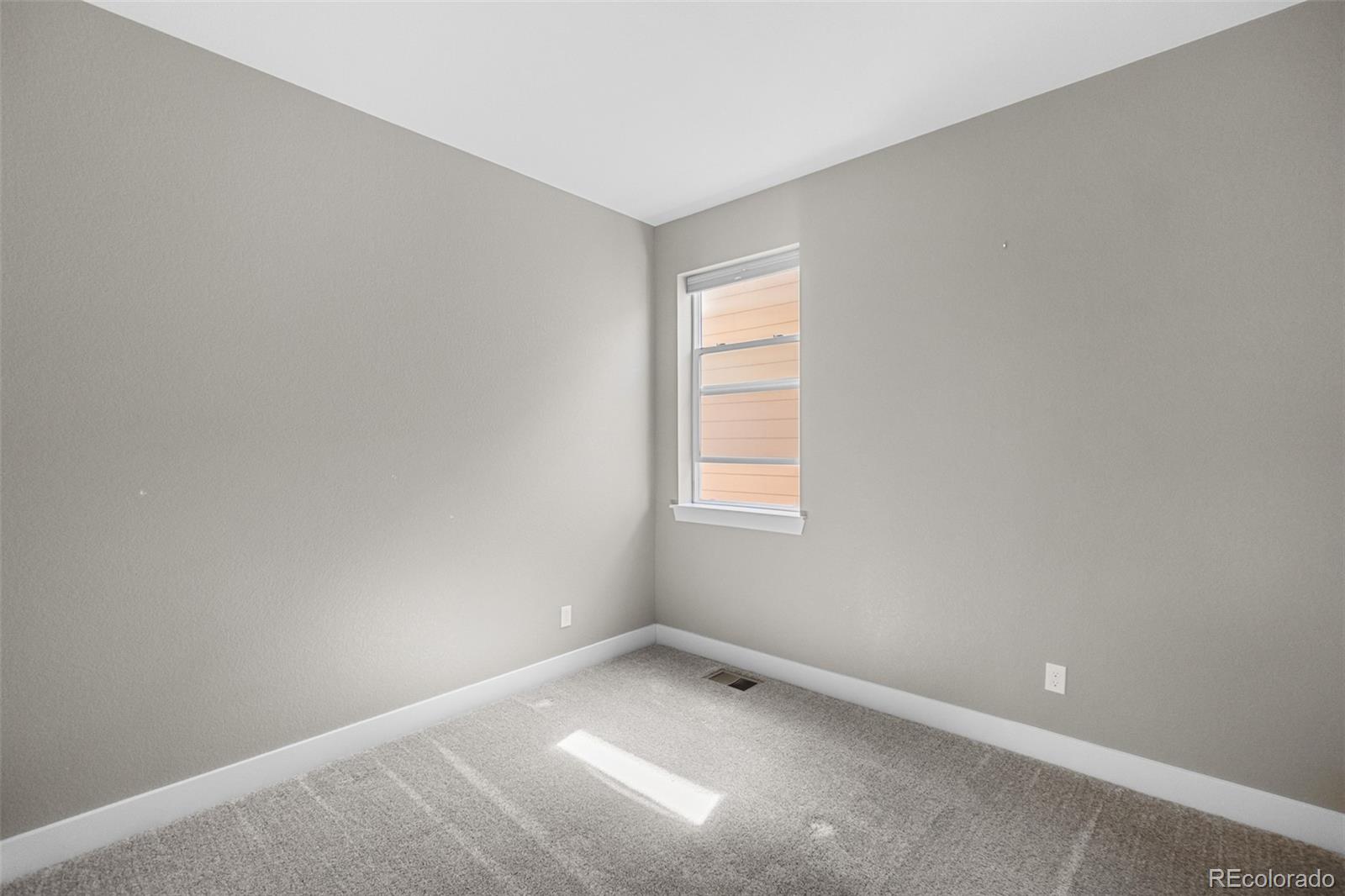 11918 Mountview Lane Broomfield, CO 80021 - Photo 17 of 32 a view of an empty room with a window