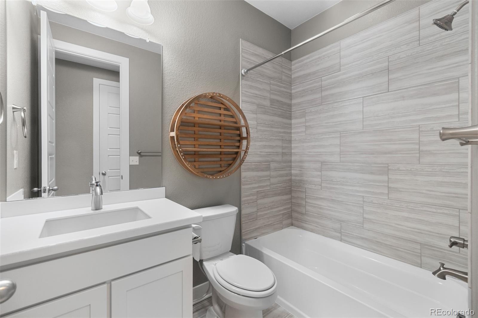 11918 Mountview Lane Broomfield, CO 80021 - Photo 19 of 32 a bathroom with a sink toilet and shower